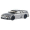 Silver Hot Wheels Nismo GT-R LM diecast car with metallic finish, black racing wheels with blue trim, wide body kit, and aerodynamic rear spoiler on a 1:43 scale model.