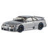Silver Hot Wheels Nismo GT-R LM diecast car with metallic finish, black racing wheels with blue trim, wide body kit, and aerodynamic rear spoiler on a 1:43 scale model.