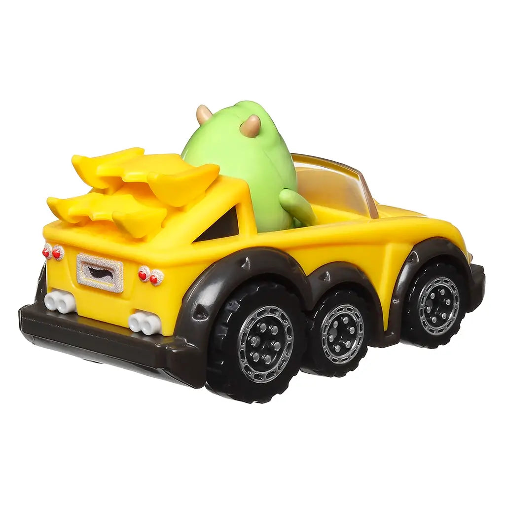 Rear angled view of Hot Wheels RacerVerse Pixar car showing Mike Wazowski seated in a yellow convertible with black tires, dual spoilers, and detailed taillights for display.
