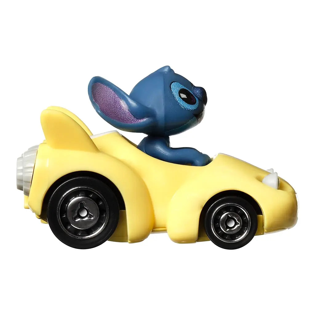 Side view of Disney Hot Wheels RacerVerse Stitch diecast car, small yellow racer with rounded body, black wheels, and Stitch figure seated in open cockpit.