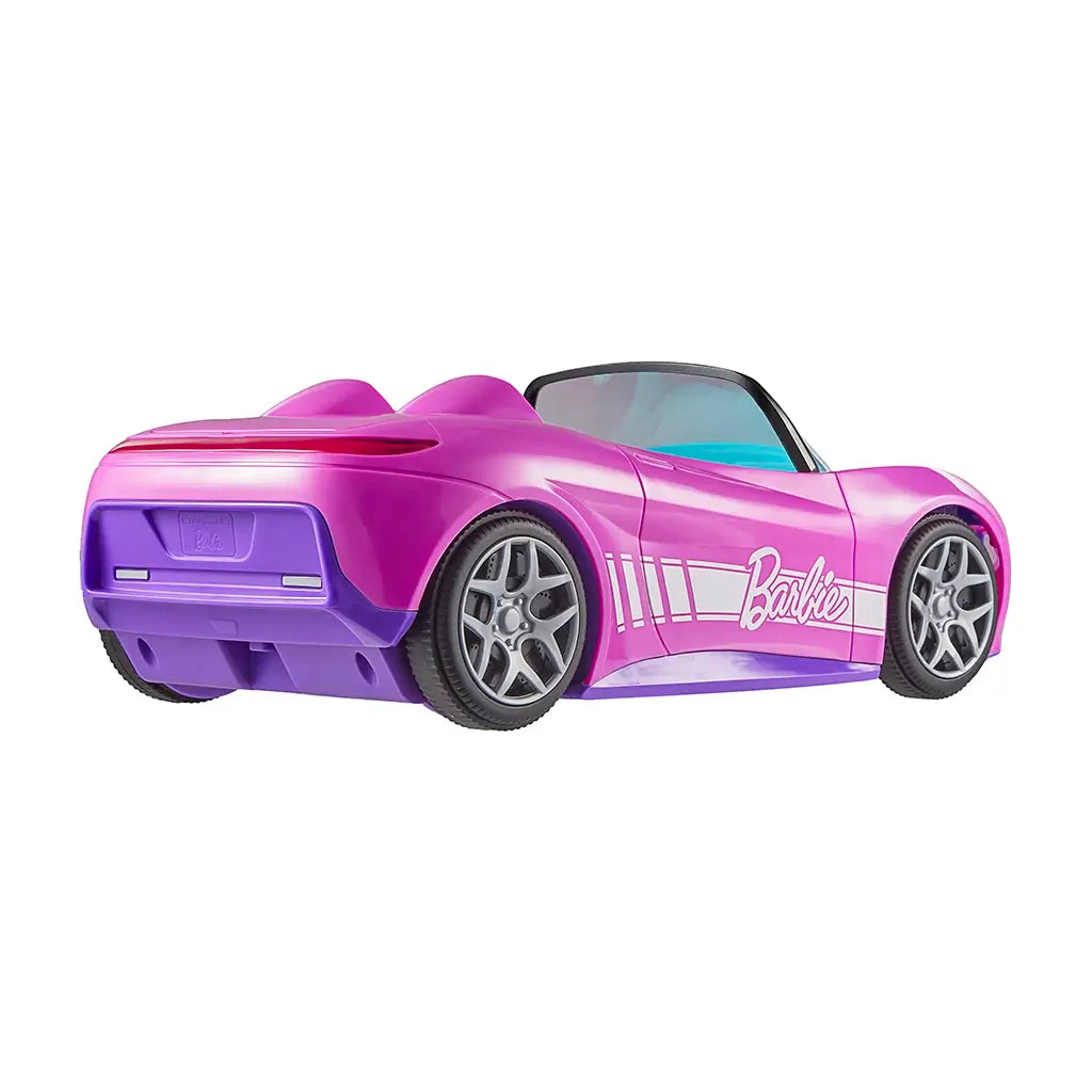 Rear angled view of Barbie RC convertible car in pink with purple accents and silver wheels, showing smooth curves and stylish sporty details for play.