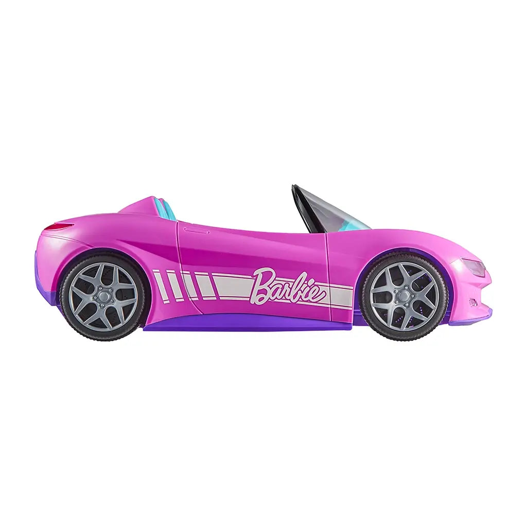Pink Barbie RC convertible toy car with silver wheels and bold Barbie logo on the side, captured in a clean profile view against a white background.