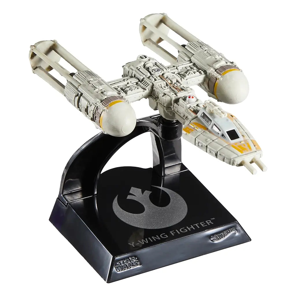 Front view of the Hot Wheels Y-Wing Fighter die-cast model on a black collector’s base, featuring yellow cockpit detailing, dual engine nacelles, and exposed mechanical body sculpting.