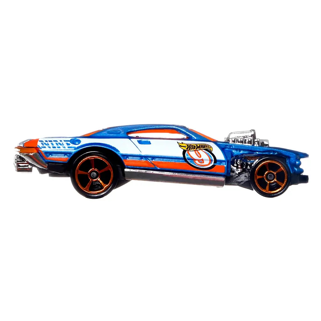 Hot Wheels Speedway Hauler race car side view showing a blue die cast body with orange and white stripes, exposed chrome engine, tinted windows, and black wheels on a white background.