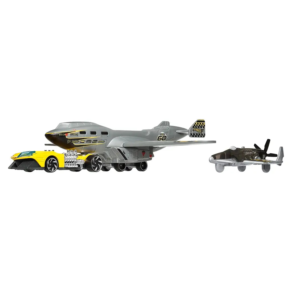 Hot Wheels Turbulence Tug set contents displayed with the gray aircraft transport vehicle, detachable components, and a compact yellow race car arranged together against a clean white backdrop.