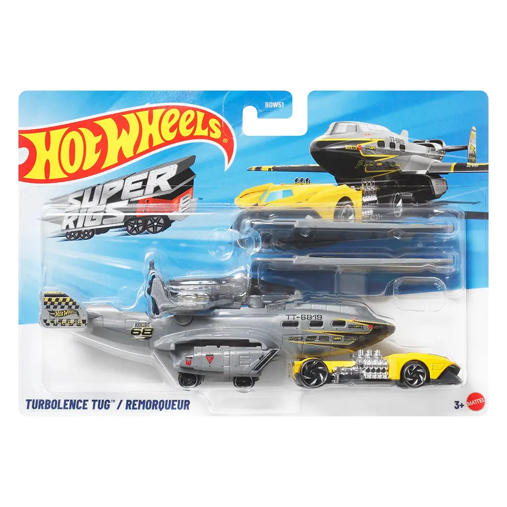 Hot Wheels Turbulence Tug package front featuring a clear plastic blister on a blue Hot Wheels Super Rigs card, displaying the gray aircraft transport and yellow race car with logos.