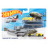 Hot Wheels Turbulence Tug package front featuring a clear plastic blister on a blue Hot Wheels Super Rigs card, displaying the gray aircraft transport and yellow race car with logos.