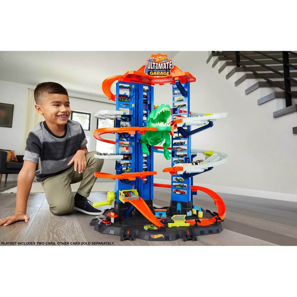Child playing with the Hot Wheels Super Ultimate Garage Play Set
