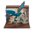 How to Train Your Dragon Gronckle dragon figure in teal and cream plastic with short wings and horned head, displayed on a clear stand with canyon scene backdrop inside a brown display case.