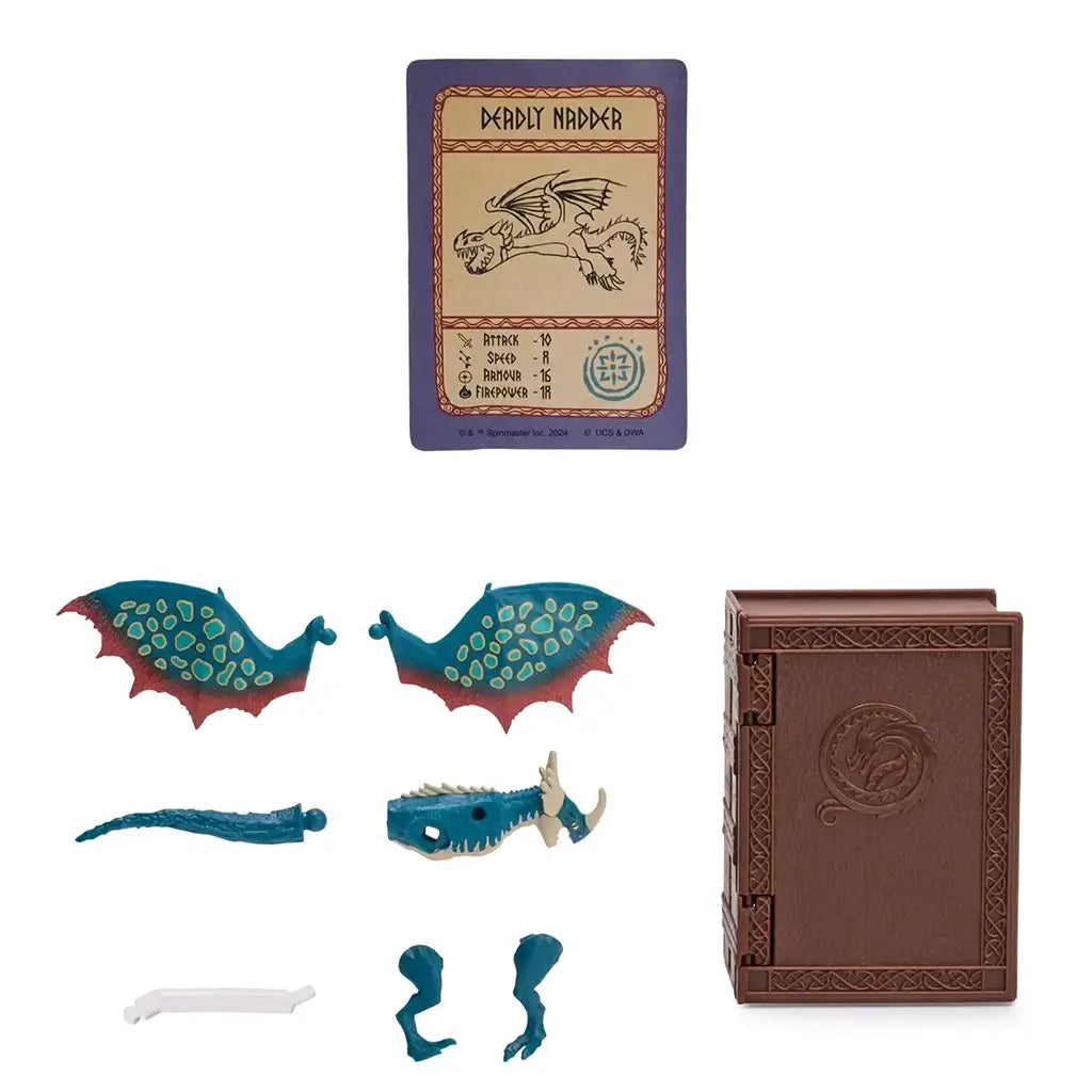 How to Train Your Dragon collectible set with teal dragon parts including wings, head, tail, and legs alongside a brown textured book case and illustrated dragon card on a clean white background.