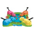 Hasbro Hungry Hungry Hippos full game layout including pink, blue, yellow, and orange hippos positioned around the blue play pool with red marbles scattered across the bright green frame.
