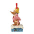Alternate side view of Jim Shore figurine with Cindy Lou Who raising her leg and hugging Max, both on a snow-dusted base with blue and holly detailing.