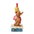 Side view of Jim Shore figurine featuring Cindy Lou Who and Max the dog standing on snowy base with holiday designs, both wearing festive attire.