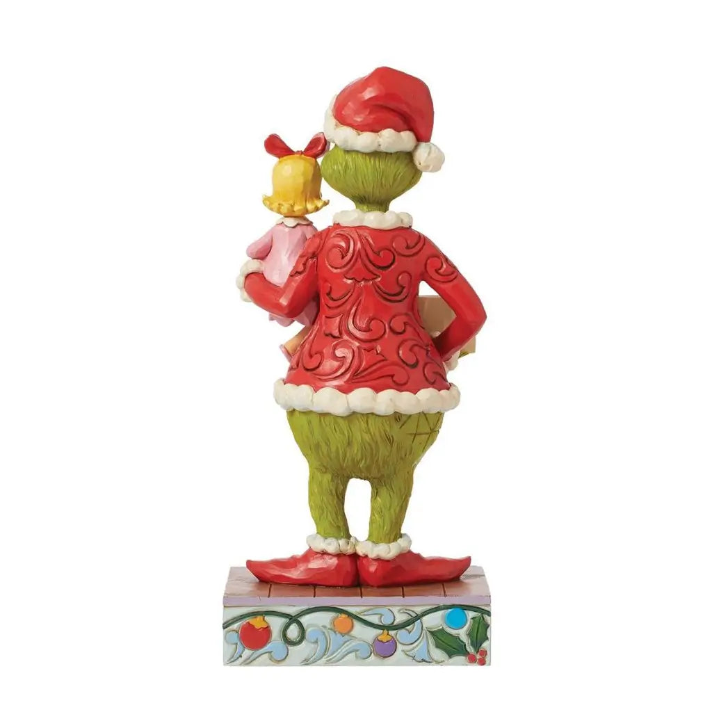 Rear view of Jim Shore Grinch and Cindy Lou Who figurine showing sculpted festive red coat, green fur, and holiday base with ornament accents.