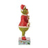 Side view of Jim Shore's Grinch figurine holding Cindy Lou Who, wearing festive red attire and Santa hats, standing on a decorative base with scroll details.