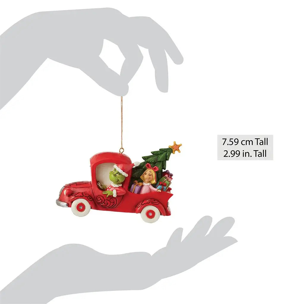 Size comparison of Jim Shore red truck ornament showing Grinch, Max, Cindy Lou, gifts, and a Christmas tree, measuring 2.99 inches tall in silhouette hands.