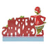 Rear view of Jim Shore "Merry Grinchmas" figurine showing reversed red letters and the Grinch standing behind them, hand on hip.
