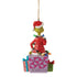 Rear view of Jim Shore Grinch ornament with the Grinch seated on a wrapped gift, wearing holiday lights and a Santa hat, surrounded by other presents.