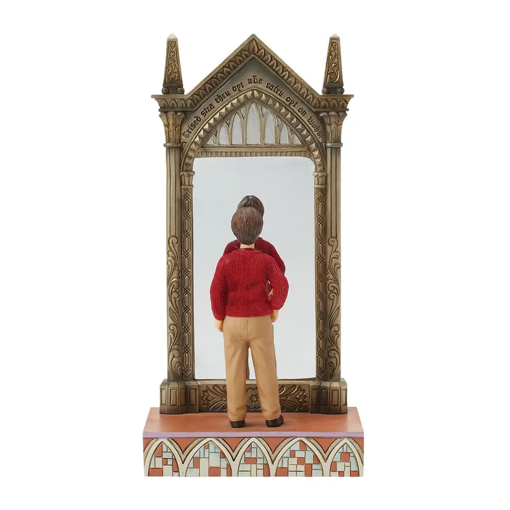 Jim Shore Harry Potter figurine shows Harry in red sweater and beige pants gazing into ornate Mirror of Erised framed with gold gothic arches on patterned base.