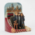 Jim Shore Harry Potter figurine angled left displays trio in Gryffindor robes beside Sorting Hat, Hogwarts Express, castle backdrop, and cascading Hogwarts letters.