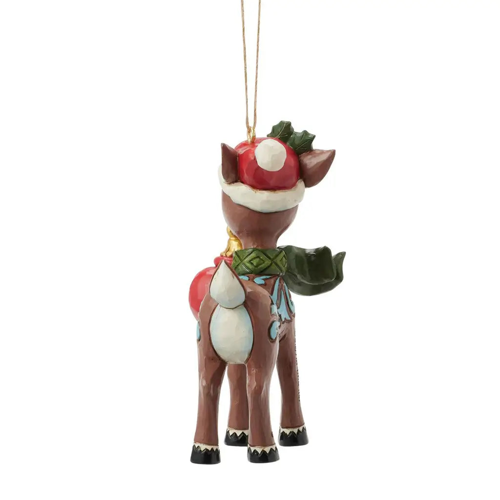 Back view of Jim Shore 2025 Rudolph ornament, with tail and scarf details, Santa hat with holly, and red ornament partially visible.