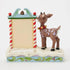 Back view of Jim Shore Rudolph the Red-Nosed Reindeer countdown calendar figurine, with candy cane-striped frame, snowy base, and folk art holly patterns.