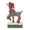 Front view of Rudolph figurine in red knit hat with green pom-pom, purple scarf, and blue side detailing, standing on snowflake-covered base with green textured trim.