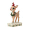 Christmas reindeer figurine with a cardinal on its head, wearing a wreath, on a white background.