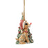 Side view of Jim Shore woodland Rudolph ornament next to Christmas tree, showing carved folk art patterns.