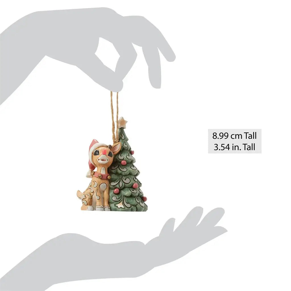Size reference for Jim Shore woodland Rudolph ornament with tree, 3.54 inches tall, shown held in hands.