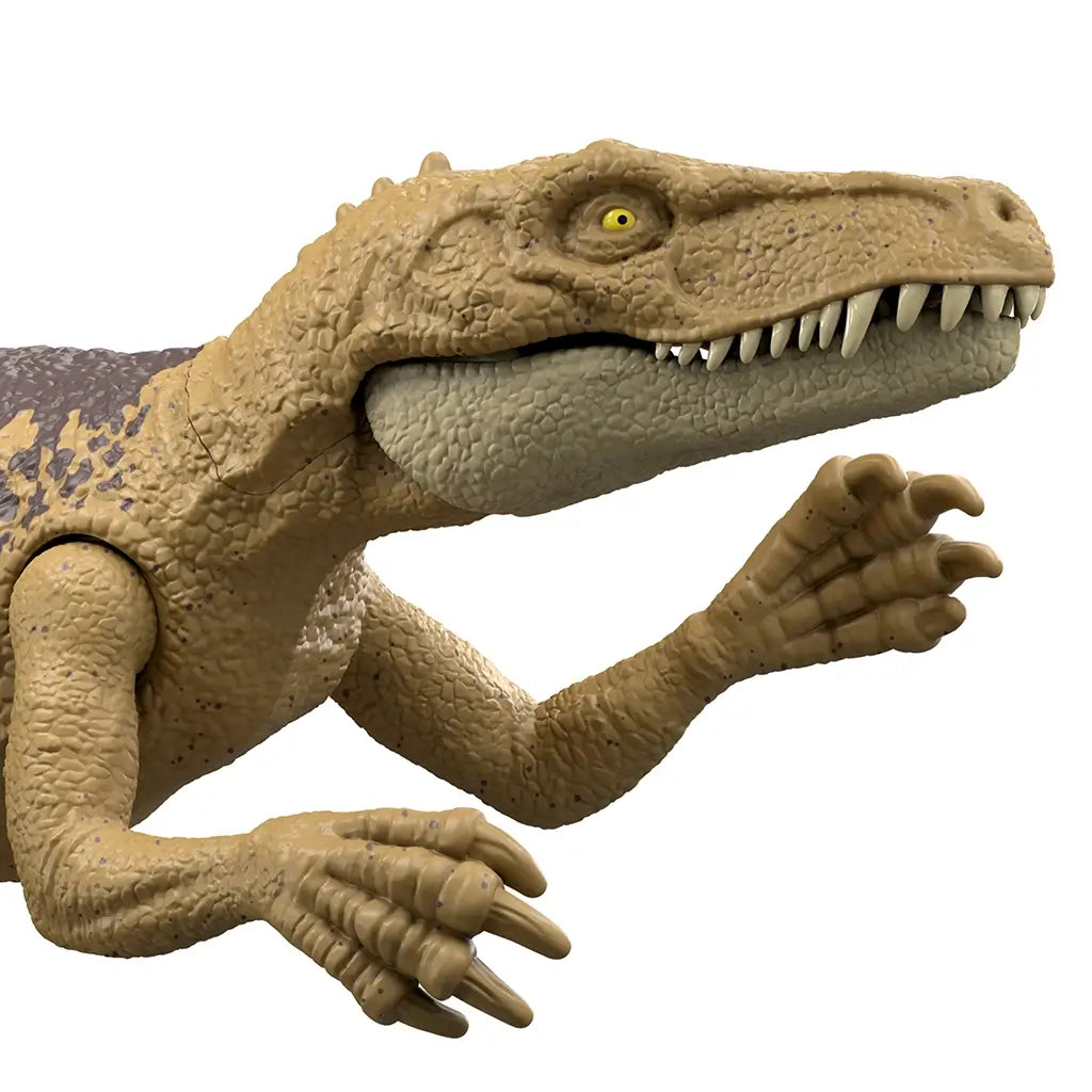 Jurassic World Herrerasaurus close-up showing a tan scaled head, beige lower jaw, sharp sculpted teeth, and yellow eye, emphasizing detailed facial texture and realistic predator styling on a plain white background.