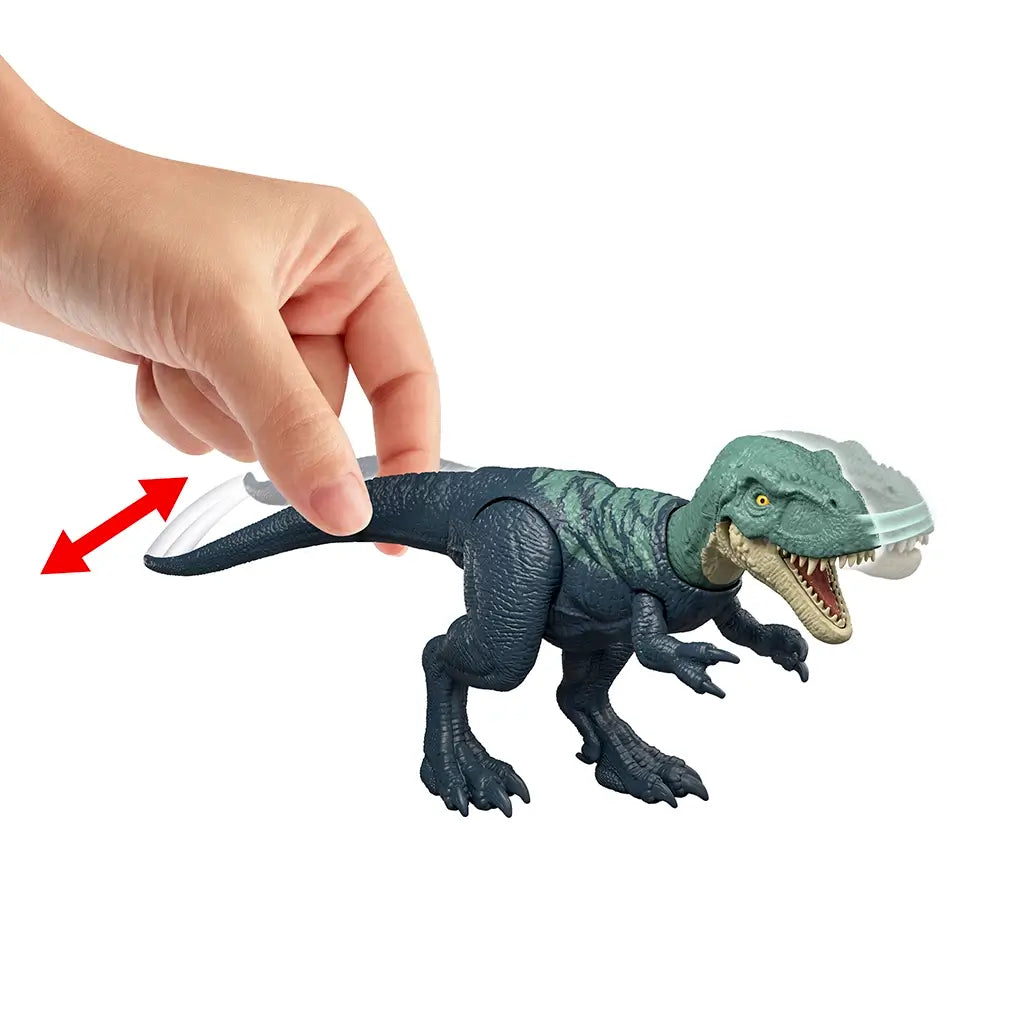 Jurassic World Nanotyrannus Strike Attack feature demonstrated as a hand moves the tail, activating head snapping motion to show articulated action play, photographed on a clean white studio background.