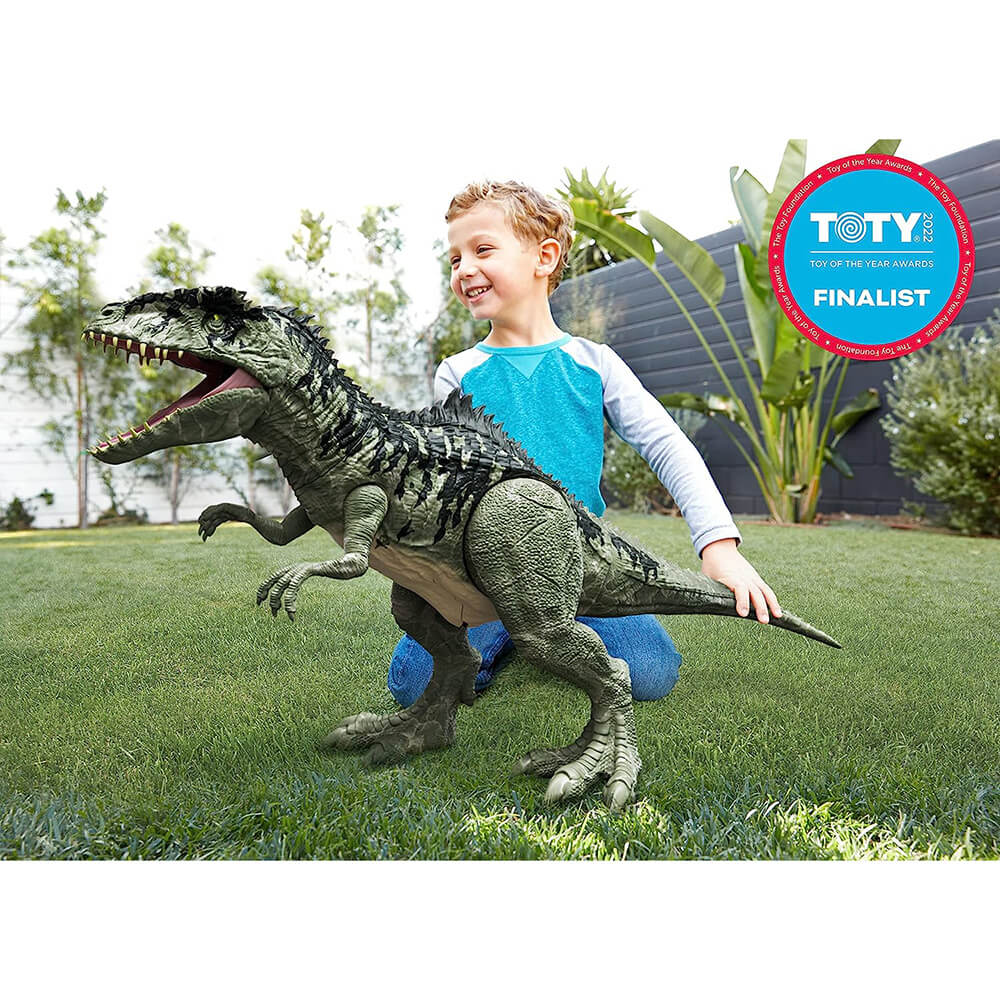 child playing with the Jurassic World Super Colossal Giganotosaurus Dinosaur Figure