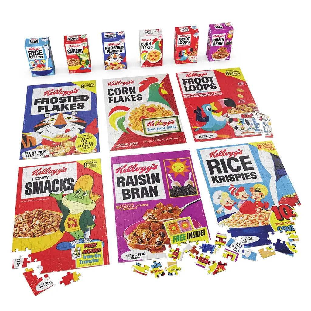 Kellogg’s puzzle collection with multicolor glossy cardboard box forms and flat interlocking pieces, featuring six classic cereal designs arranged on a white tabletop studio background.