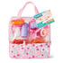 Kidoozie Doll Care Playset in a clear pink floral storage bag includes colorful bottles, pacifier, dishes, and feeding accessories neatly arranged inside with product tag attached.