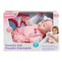 Kidoozie Sweetie Doll in retail packaging shows 12-inch baby doll in pink outfit with floral details, bottle, diaper, and product features in English and French.