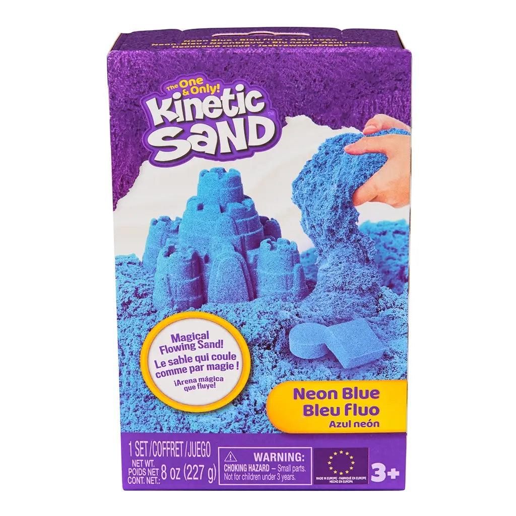 Kinetic Sand neon blue sand product box purple cardboard rectangular front showing blue sand castle and flowing texture for kids sensory play, positioned on a clean white background