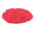 kinetic sand neon red sand bright red soft crumbly texture forming a low rounded mound shape for creative molding and tactile sensory play, displayed on a plain white background
