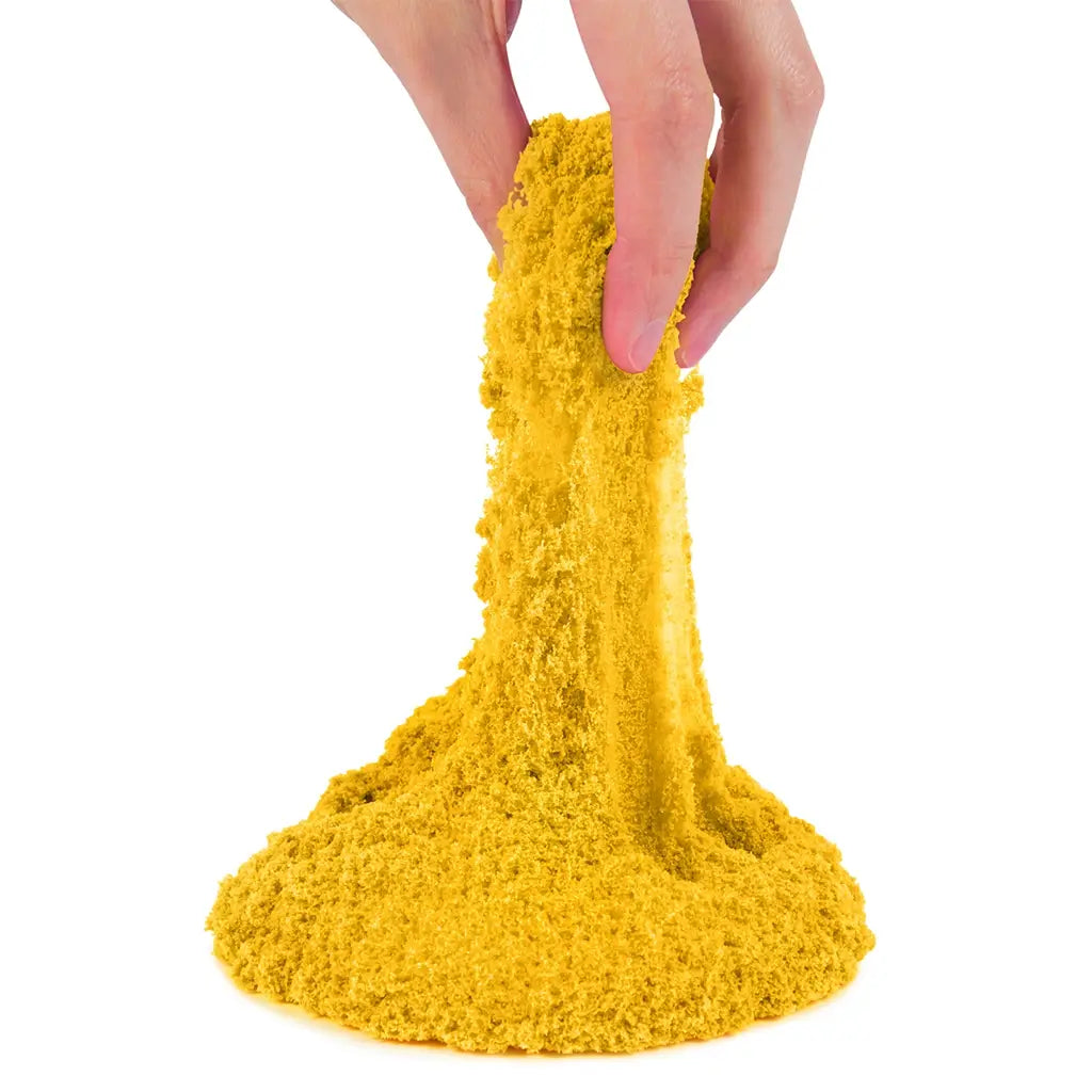 kinetic sand neon yellow sand bright yellow soft crumbly texture stretched by fingers into a flowing form for hands-on sensory play, shown against a clean white background