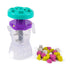 Clear plastic Kinetic Sand Smoothie Mixer blender with purple collar, teal lid, internal gray blades, and sturdy base, designed for hands-on mixing and imaginative sensory play on white background.