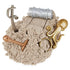 Brown Kinetic Sand mound with pirate-themed tools including a sword, shovel, octopus ring, and barrel, highlighting soft moldable texture and interactive treasure hunt play on a white background.