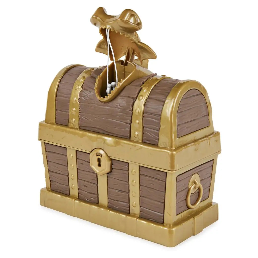 Brown and gold Kinetic Sand toy treasure chest with faux wood panels, riveted metallic bands, skull latch, and curved lid, designed for kids treasure hunt play and sand storage on a white background.