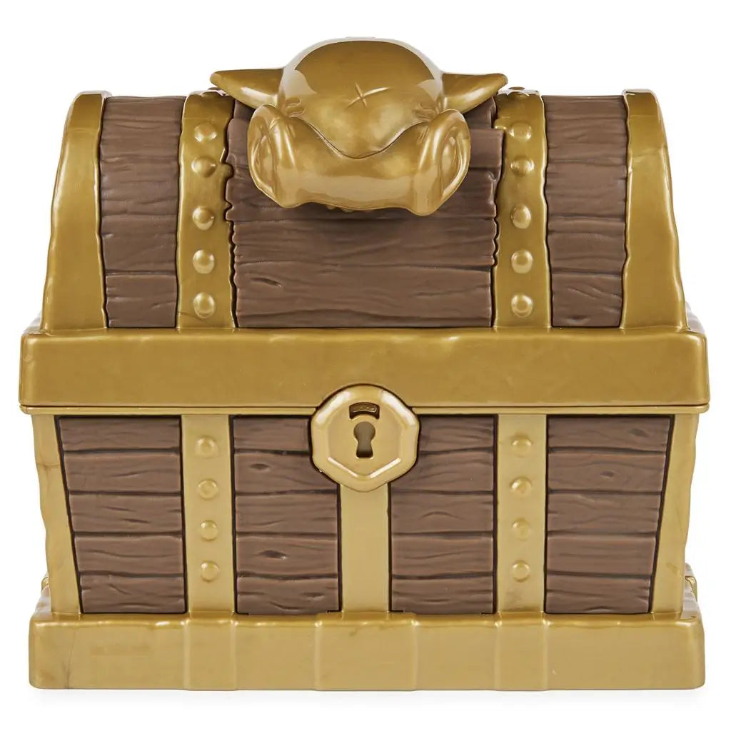 Brown and gold Kinetic Sand toy treasure chest with faux wood texture, metallic bands, skull latch, and lock detail, closed and centered to show pirate treasure theme on a clean white background.