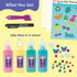 Klutz Jelly Stickers contents include four jelly paint bottles, rhinestones, sequins, plastic sheets and tools laid out on a pastel background emphasizing the vibrant materials provided for creative sticker making.