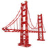 Assembled K'NEX Architecture Golden Gate Bridge model in bright red with detailed suspension cables, towers, and realistic structural elements for display.