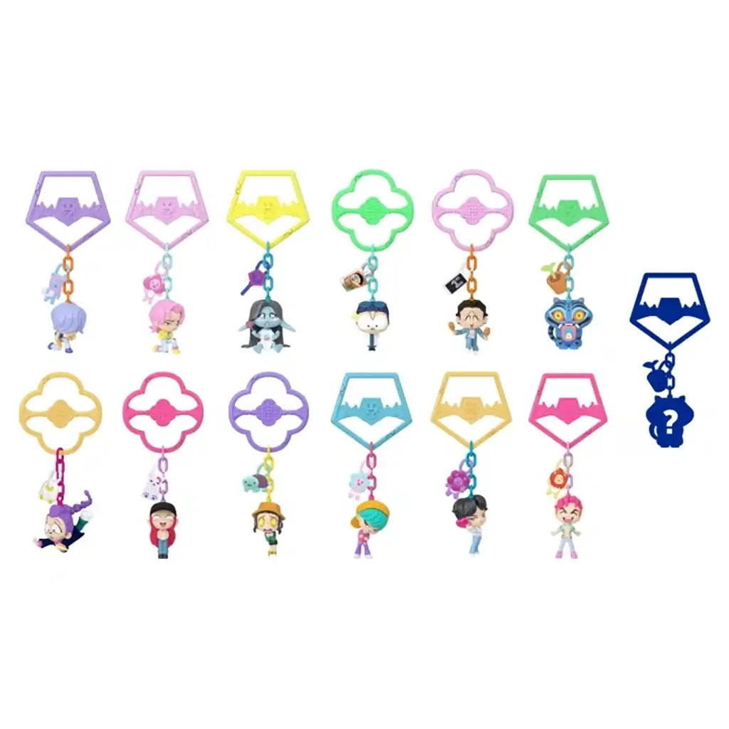 KPop Demon Hunters mini figure collection features colorful plastic character keychains in purple, pink, yellow, green and blue, arranged in two rows on white.