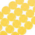 Left Center Right game chips in bright yellow molded plastic with ridged edges and circular shape, spread across a white surface in a neat overlapping pattern.