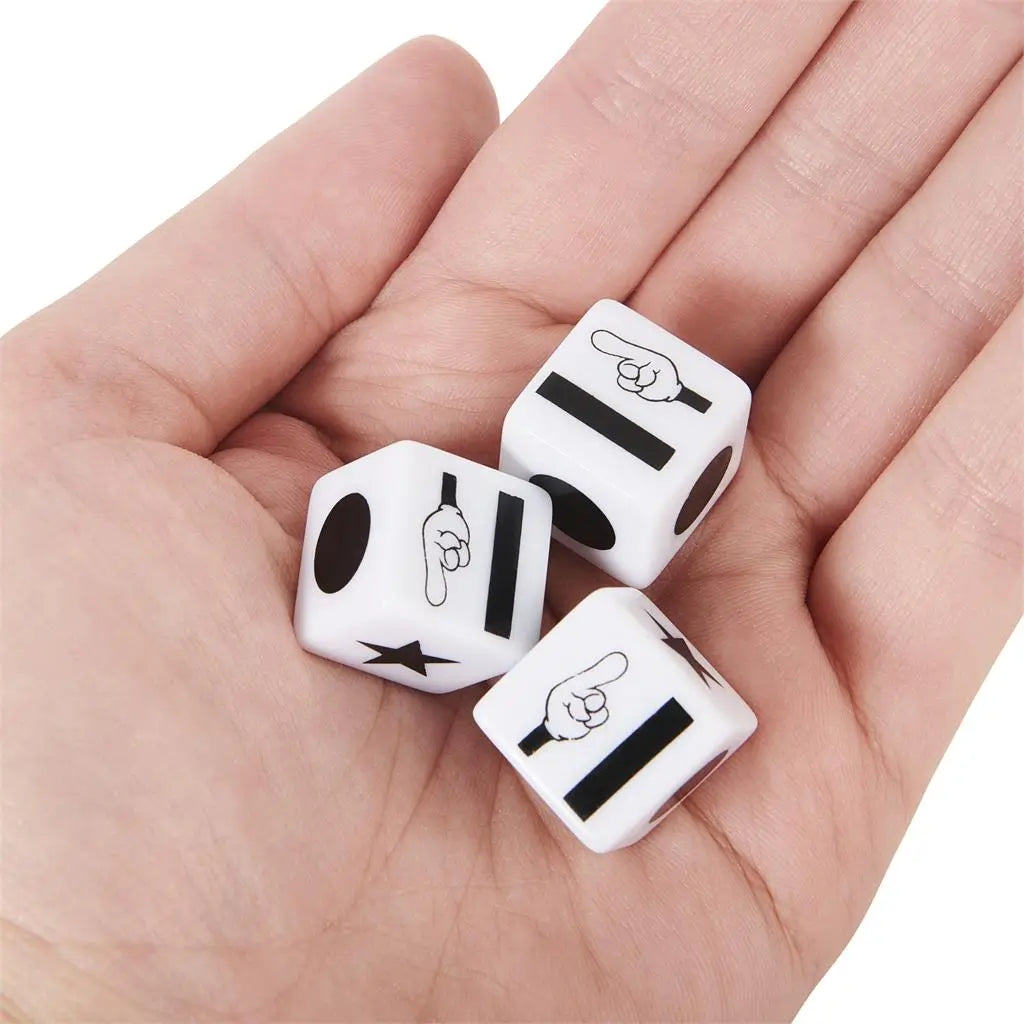 Left Center Right dice in white plastic with black dot, star, and directional hand icons, shown resting in an open palm against a neutral white background.