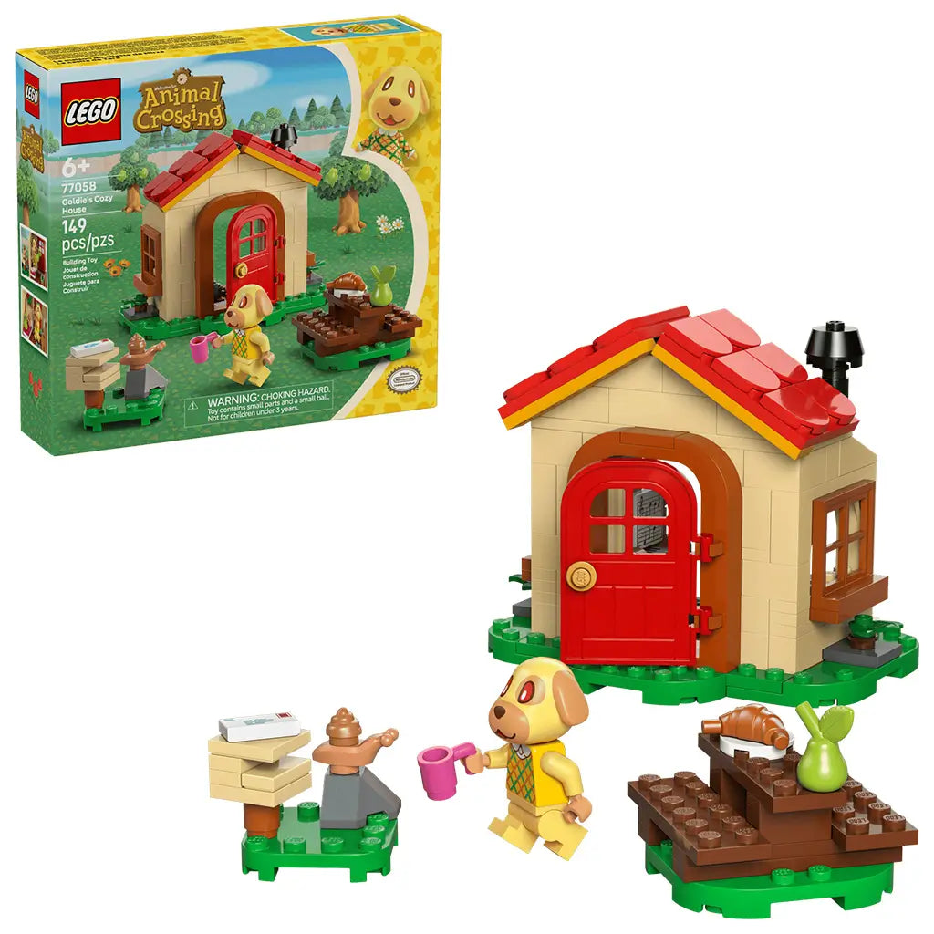 LEGO Animal Crossing Goldie's Cozy House playset features a tan cottage with a red roof, Goldie minifigure, mailbox and picnic table on a clean white background with detailed LEGO elements and realistic display presentation.