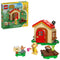LEGO Animal Crossing Goldie's Cozy House playset features a tan cottage with a red roof, Goldie minifigure, mailbox and picnic table on a clean white background with detailed LEGO elements and realistic display presentation.